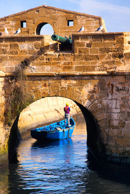 Fishing Boat Passing Under the Fortifications