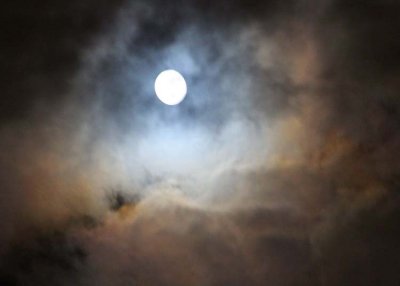 christmas full moon lights up a stormy sky