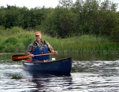 Terry is happy on the Namekagon with the paddle Darryl made for him.jpg