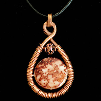 hand forged copper pendant with shell disc 