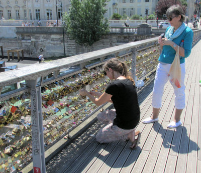 Attaching our padlock to the footbridge. 