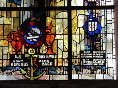 Detail from the stained-glass window commemorating the 25th anniversary of the liberation of the town by the 82nd Airborne.