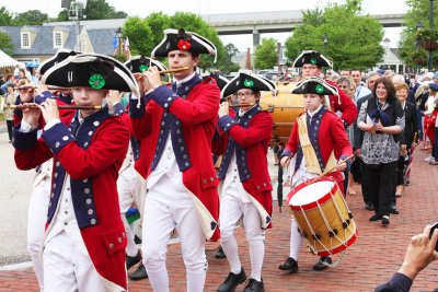 Fife and drums march past. 