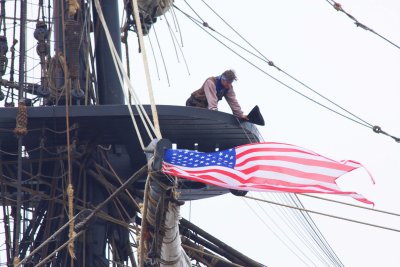 A sailor looks down from the Main Top.