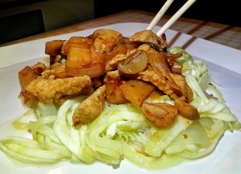 Stir-Fry Pork, Pineapples, Mushrooms, Onions & Bamboo Shoots in a Teriyaki Sauce on a bed of Zucchini Noodles