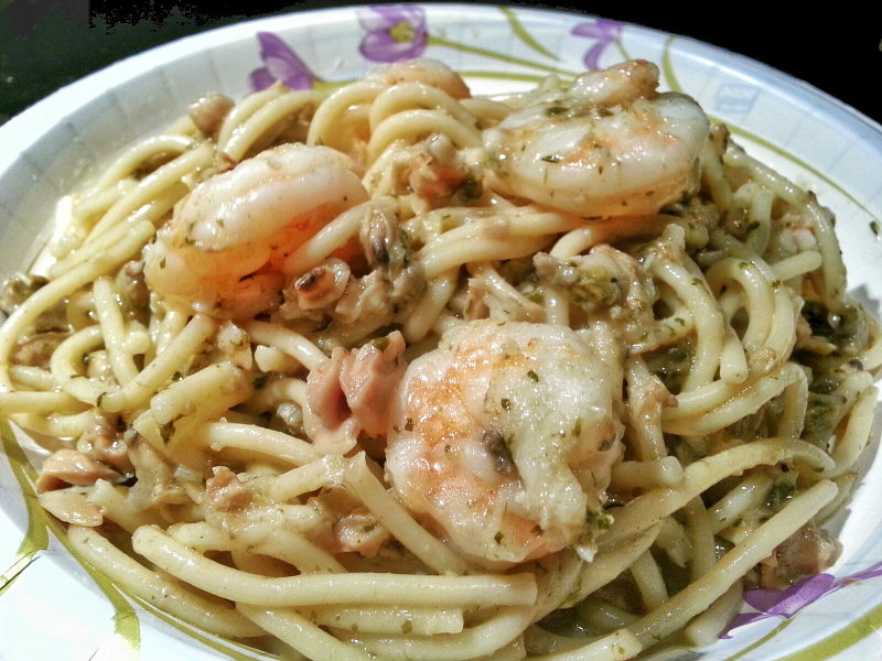 Spaghetti with clams and shrimp with garlic and herbs.