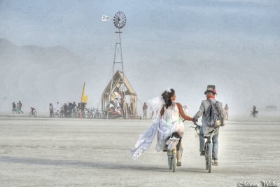 Wedding Couple biking away