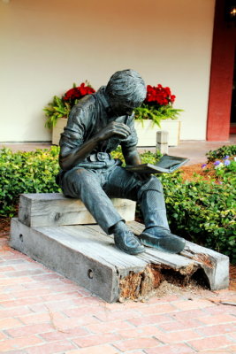 Boy reading book, Harbour town