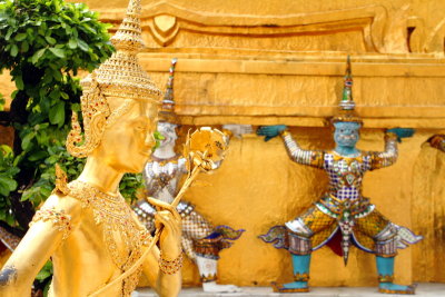Statue of a kinnari with a rose in Wat Phra Kaew, Grand Palace