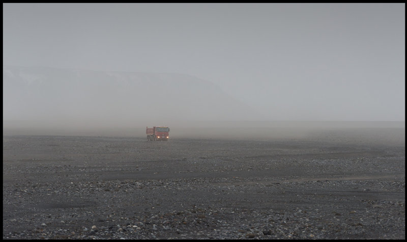 Truck in sandstorm near Vik