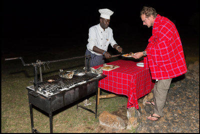 Our Tanzanian chef serving Tommy food our last day in the Mara camp