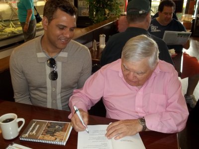 Jacques Wiesel signs his book for Aelson Cacique