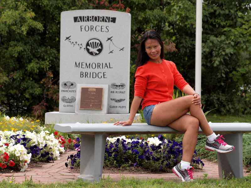 Of Course She Had To Pose By These Flowers...