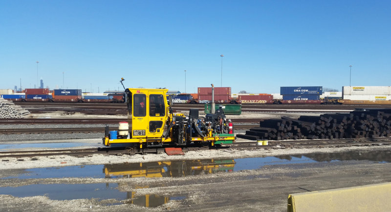 Some Track Equipment At BNSF Yard, Pulaski...With Downtown Chicago In Background