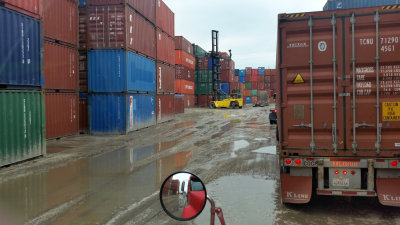 That's A Very Small Crane Lifting That Container Onto The Chassie