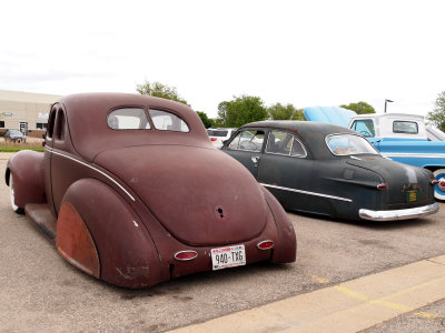 A 49 Ford, Lowered And With Skirts And Its Older Brother...