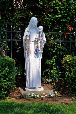 Statue With Lots of Rosaries