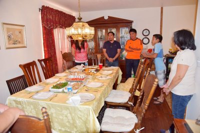 Lawrence, leading thanksgiving prayer before dinner.