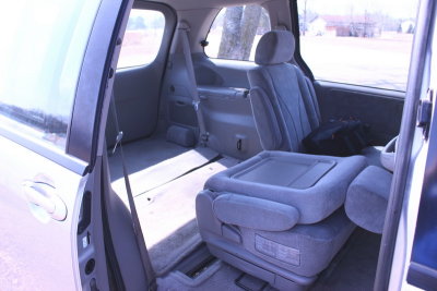 Mazda Rear Seat Slid over and folded down for access to rear._resize.JPG