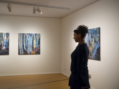 Alice Springs Araluen Art Centre - Emma Stuart with her paintings - Hidden Arrernte Exhibition