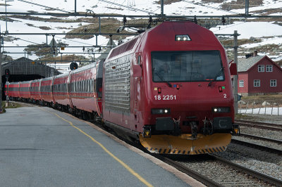 Train from Bergen to Oslo at the station in Finse 