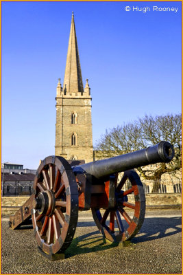 Ireland  - Derry - St Columbs Cathedral Cof I with cannon on city walls