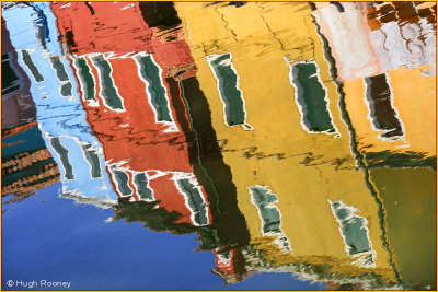 Venice - Burano Island - Colourful housing reflected in canal 