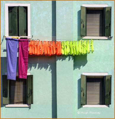  Venice - Burano Island - Colourful washing on house facade 