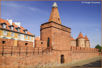   Warsaw - Old Town - City wall with Barbakan or Barbican defensive gate. 