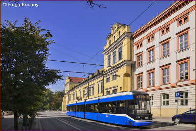  Krakow - Archbishops Palace with city tram passing by 
