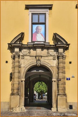  Krakow - Archbishops Palace entrance with picture of Pope John Paul 2nd 