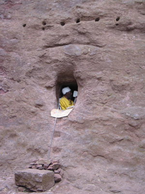 Hermit who lives inside this tiny cave carved in the church courtyard walls