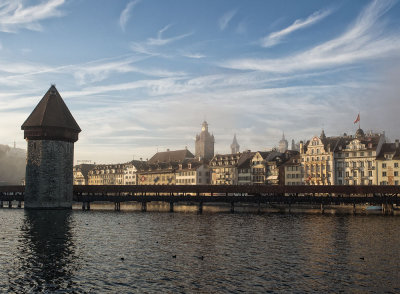 Chapel bridge and old city town by sunset