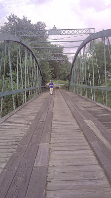 Wayne on old bridge that crosses roug river.jpg
