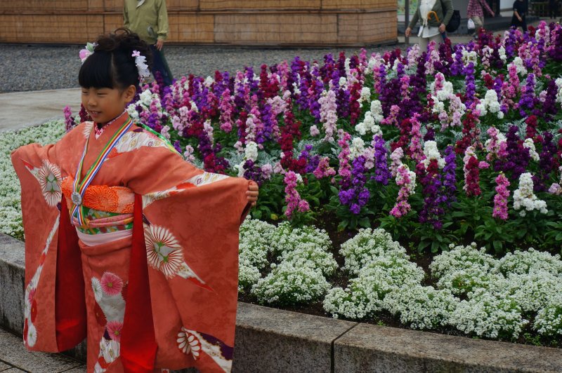 Girl posing for her parents