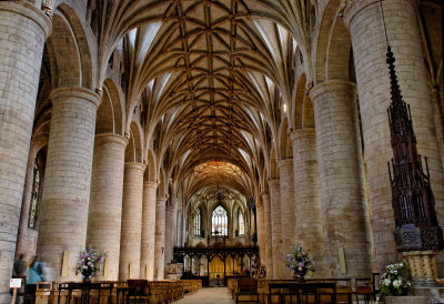 splendid nave arcades, but with later vaulting & very spiky font cover extreme right