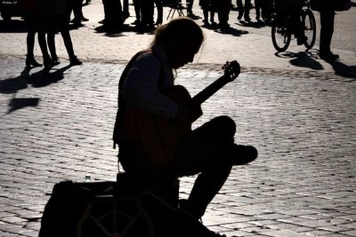 Strumming guitar in afternoon light
