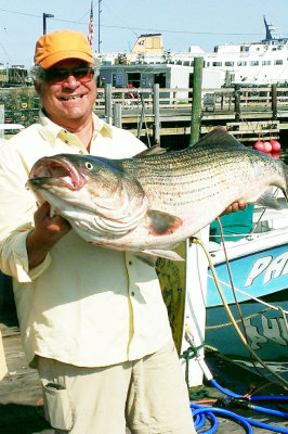 Tommy, your arms look sore from holding that BIG striper!!