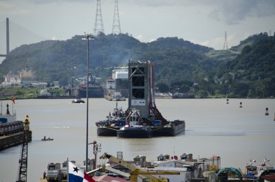 First gate being moved by tugboats into the Miraflores locks