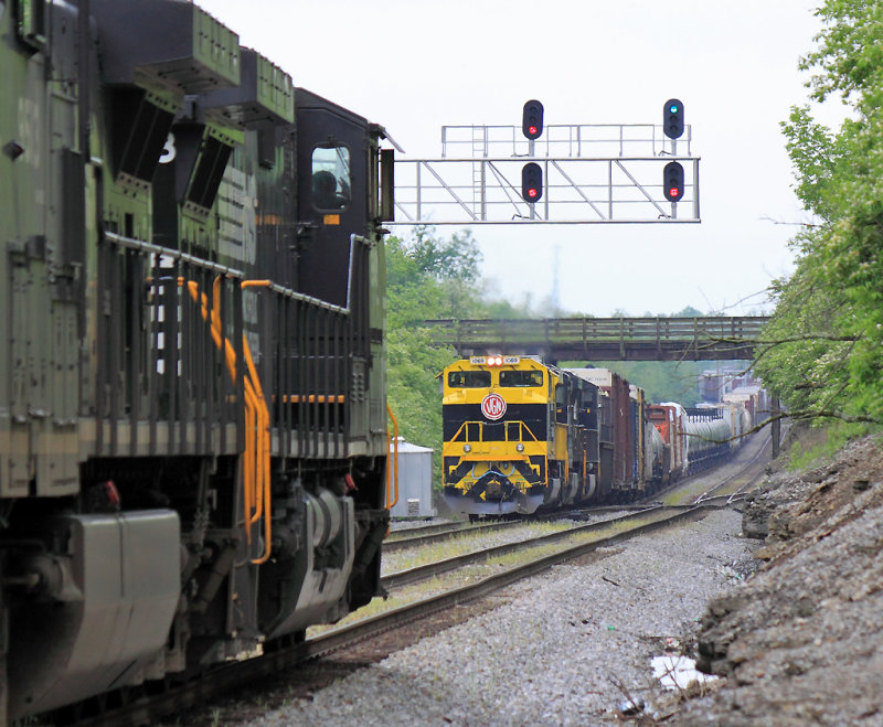 The engineer on Southbound 215 salutes the crew on 142 at North Wye 