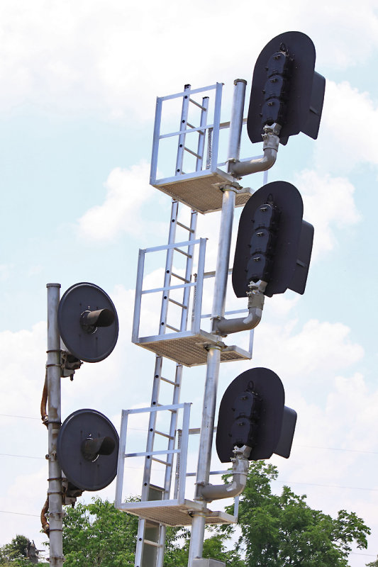 The old searchlight signals are still in place, as the new replacements lean out of the way for now 