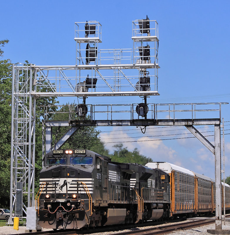 The new signals are up (but not yet in service) as train 275 comes South on a hot afternoon 