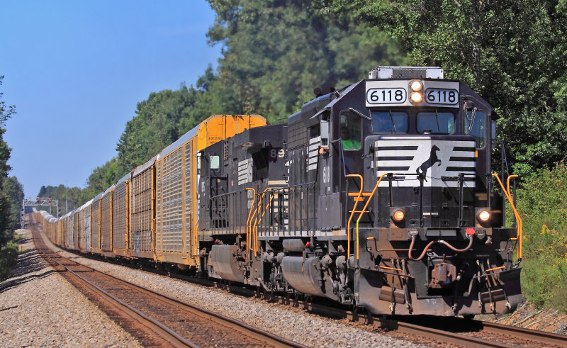NS 275 flies down the tangent at Gradison with a EMD on the point and over a mile of racks stretched through the dips 