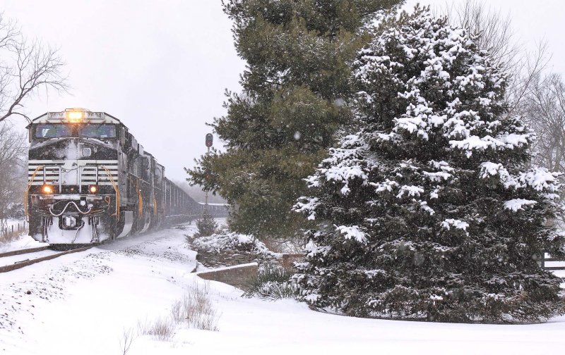 A heavy 704 coal train struggles to get back on the move at Talmage after meeting 224