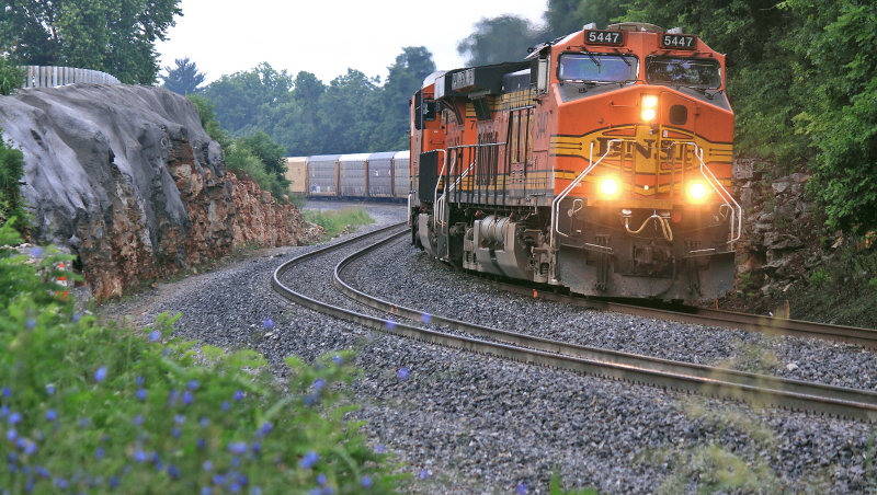 NS 282 winds through the new cut near the Pittman Creek bridge on a cloudy morning  