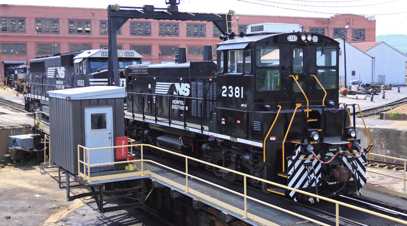NS 2381 shoves a SD60E off the table at  Juniata 