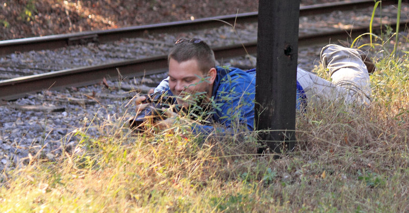 Tyler in the grass snipe hunting 