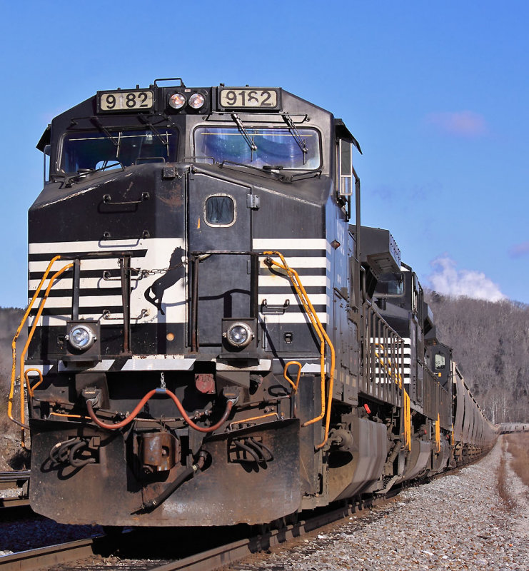 A battered old Dash-9 leads a Southbound grain train at CP General 