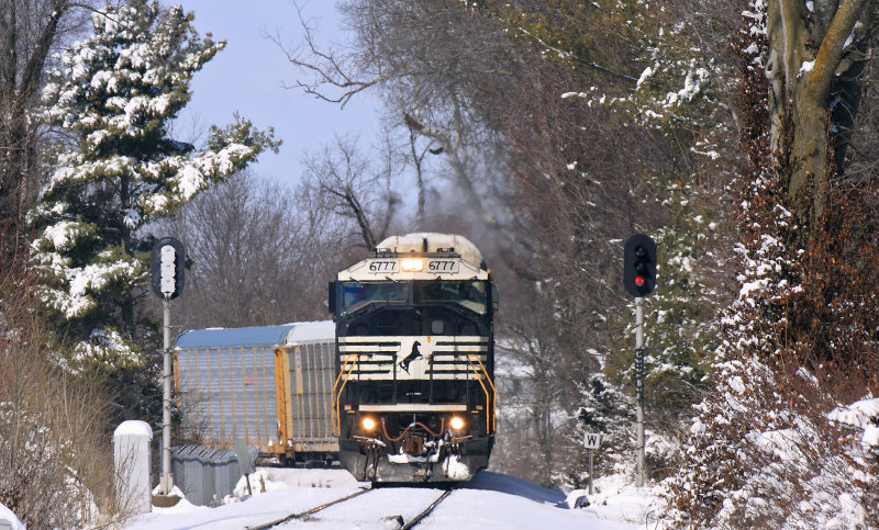 Eastbound 167 passes the block at West Harrodsburg, slowing for the street running in town 