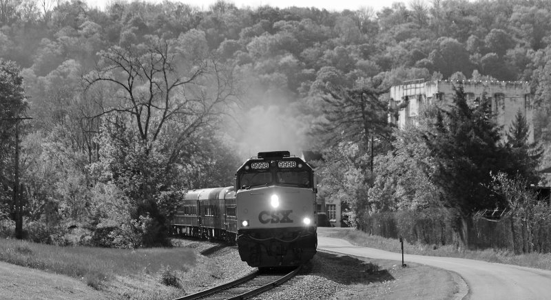 The CSX Derby train passes an old distillery as it departs Frankfort 